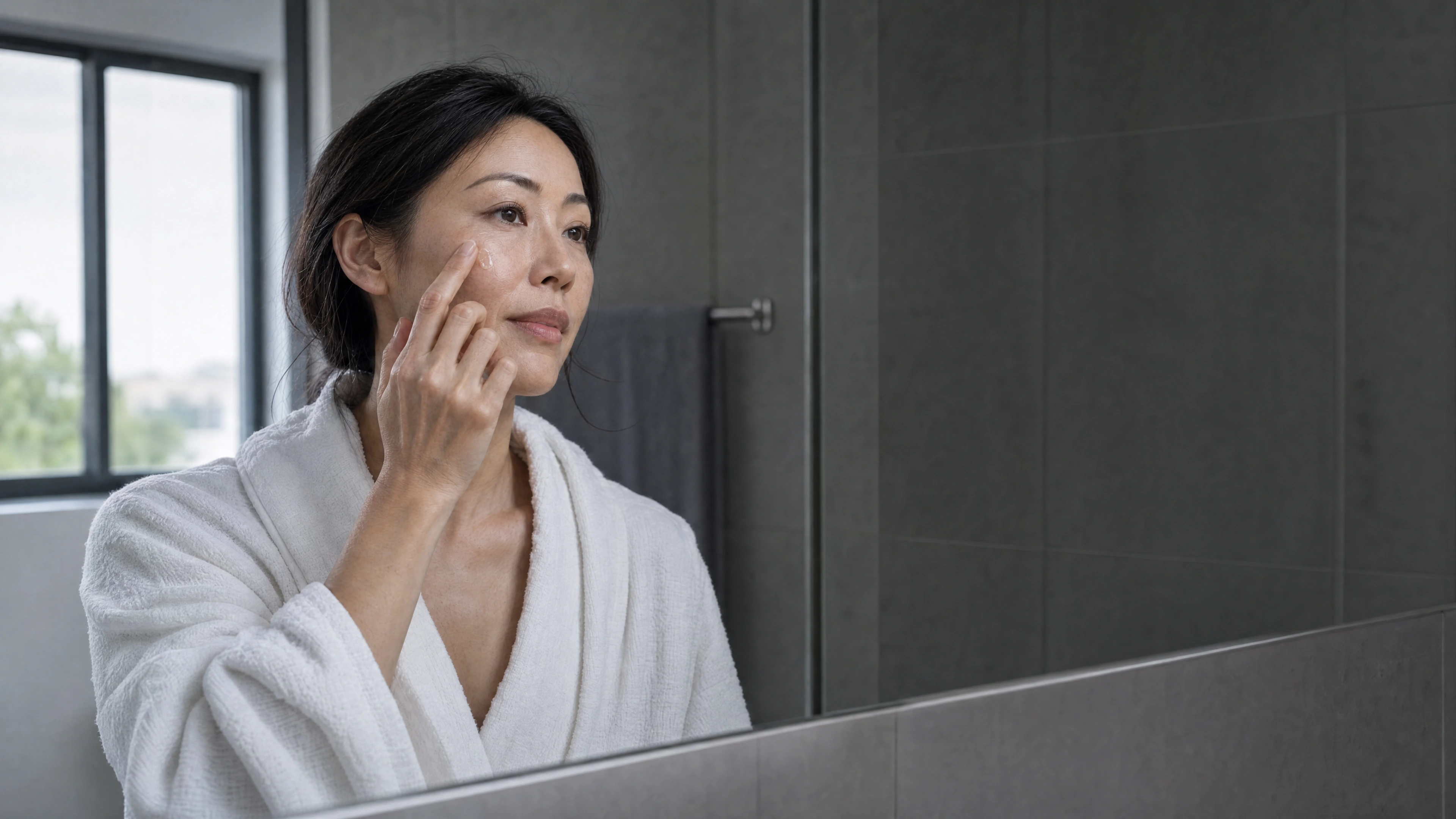 A woman taking a moment for her skincare routine